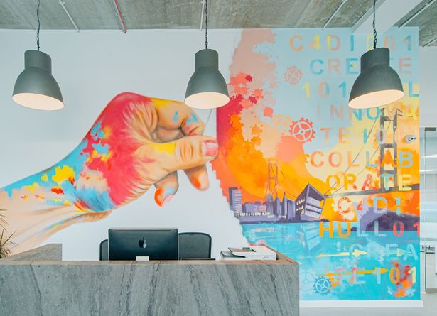 A striking graffiti backdrop welcomes visitors to the reception area in the revamped C4DI building in Hull