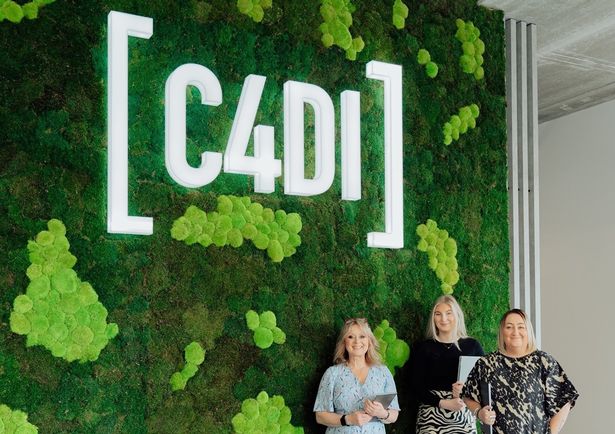 C4DI director Linsey Brown, right, with colleagues Tina Swann, event coordinator, left, and Kaitlin Lander, marketing and communications coordinator, in front of a preserved moss wall, a centrepiece feature of the revamped tech hub
