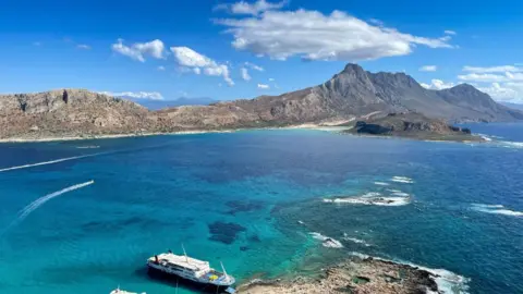 Getty Images Mountains and blue water in Crete