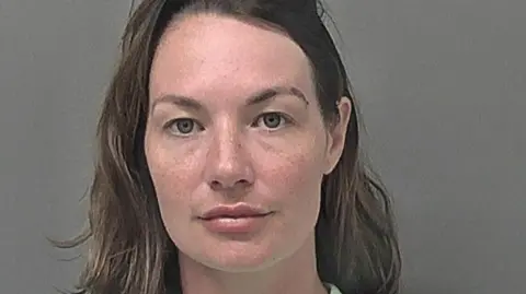 Humberside Police Lucy has blue eyes and brown medium-length hair, which is slightly wavy.
