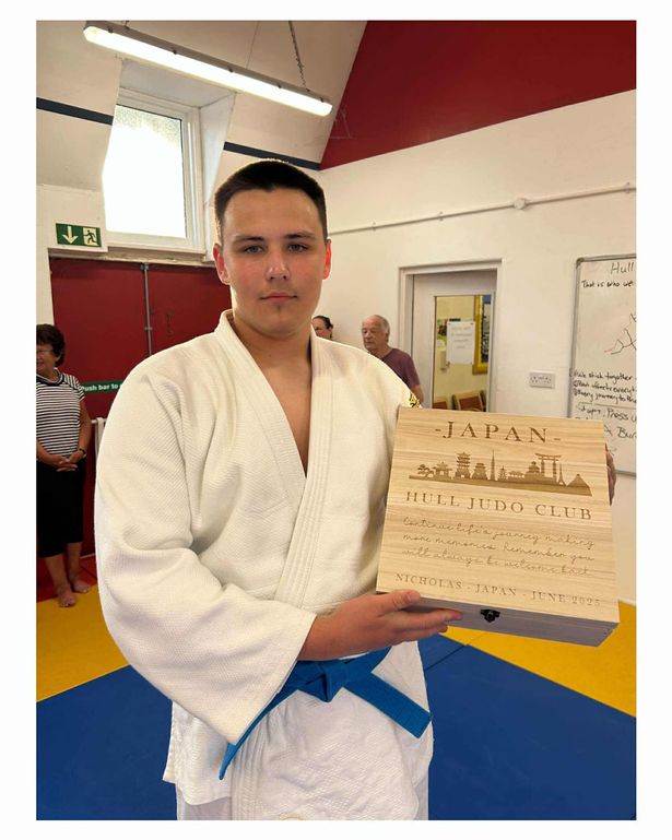 Hull Judo Club present Nicholas with a memory box ahead of his departure for Japan