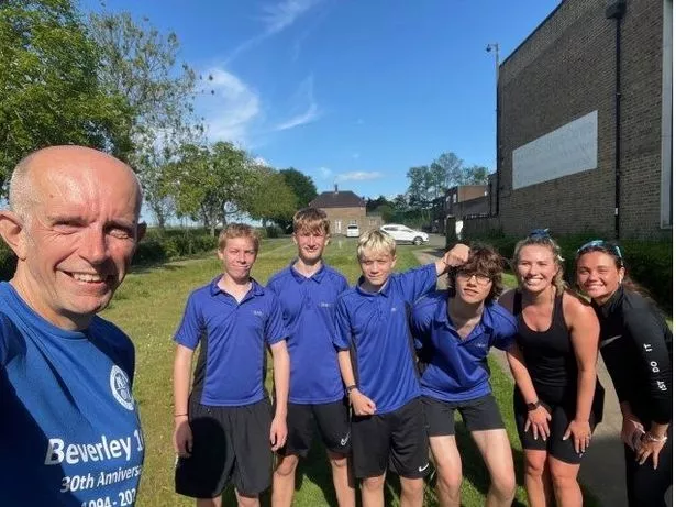 Zac, centre, and runners supporting him in his half-marathon challenge