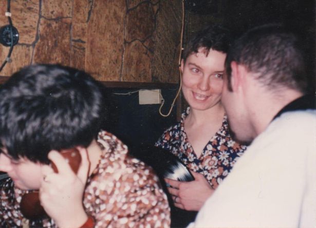 DJ Sonya with a vinyl record at one of the club nights