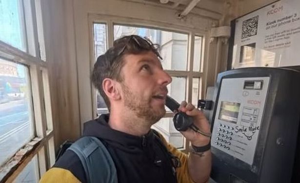 Documentary film-maker David Burnip tries out a Hull telephone box for his YouTube channel, Wandering Turnip