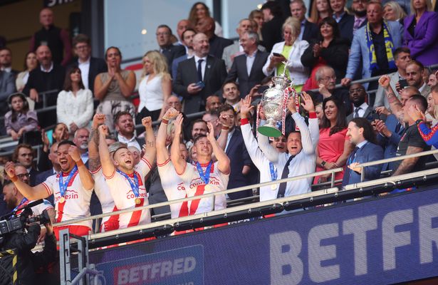 Willie Peters lifts the Challenge Cup trophy.