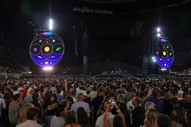 Fans wait for Coldplay to take the stage on a stop of the band's Music of the Spheres world tour in Las Vegas