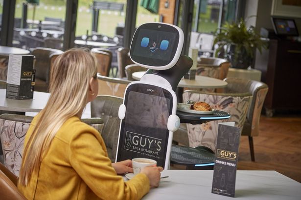 A customer has a snack delivered by a robot server, one of the new hi-tech features of the transformed Country Club at Patrington Haven Leisure Park