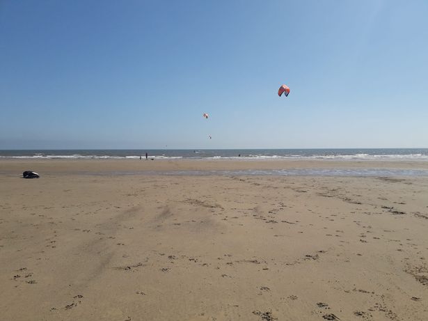 Kiteboarders riding the wind and waves between Bridlington South Beach and Fraisthorpe Beach
