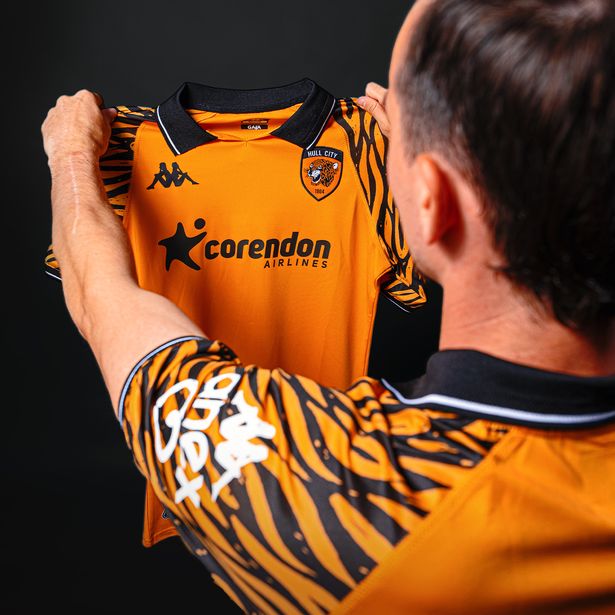 Liam Millar with Hull City's new home strip