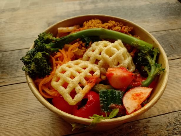 A beautiful salad with udon noodles, cous cous, olives, stuffed peppers, radishes, tenderstem broccoli