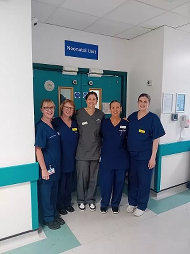 Victoria Ingram, Sally Aitken, Rachel Foxwell, Claire Douglas and Alexandra Smuts in front of the unit