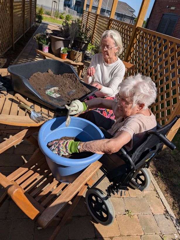 Residents of Primrose House in Brough get stuck in to some garden tasks