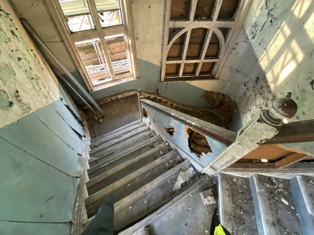Before - the main staircase within Castle Buildings showing the effects of decades of dereliction before the landmark was rescued