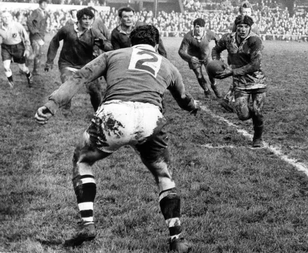 Hull KR's Flash Flanagan takes the ball up with FC defenders Pearson, Broom, Harrison and Stocks waiting in the 1966 Christmas Day derby