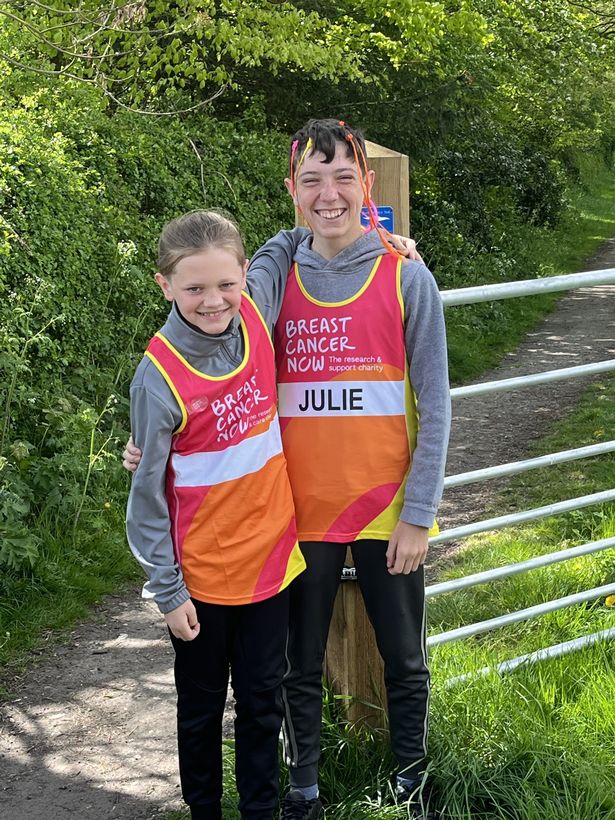 Ten-year-old Ernie, left, with his brother Alfie, taking part in a Breast Cancer Now sponsored run/walk in memory of their mum, Vicki Marshall