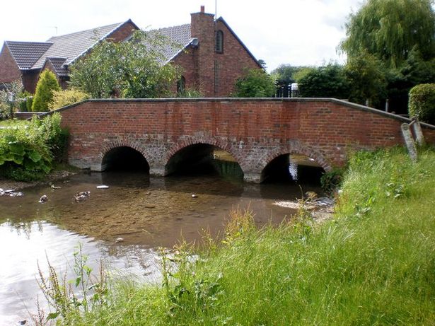 The Gypsey Race chalk stream and East Gate bridge at Rudston