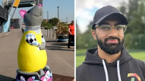 BBC Two images side by side. On the left a rat statue and on the right a man with a black cap and hoody smiling. He is wearing round, clear glasses.
