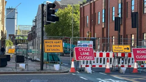 LDRS Road closure and diversion signs on Alfred Gelder Street in front of barriers and traffic cones blocking the road.