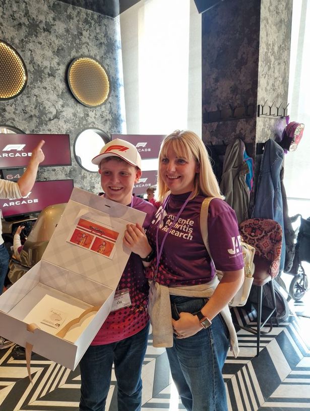 Oli and mum Clare with the signed cap