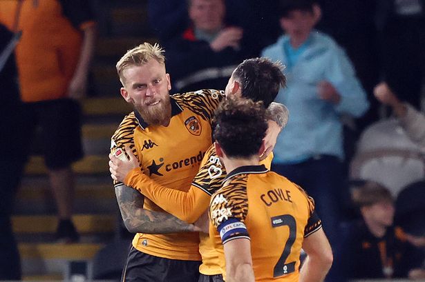Hull City's Oliver McBurnie is mobbed by his team-mates 