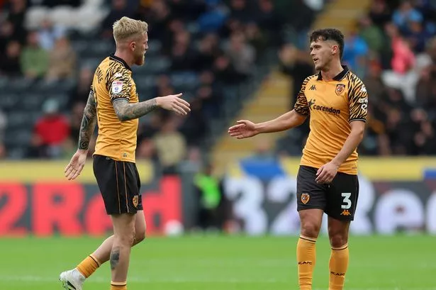  Oli McBurnie of Hull City shakes hands with teammate Ryan Giles as he leaves the pitch following being substituted during the Sky Bet Championship match between Hull City and Sheffield United 