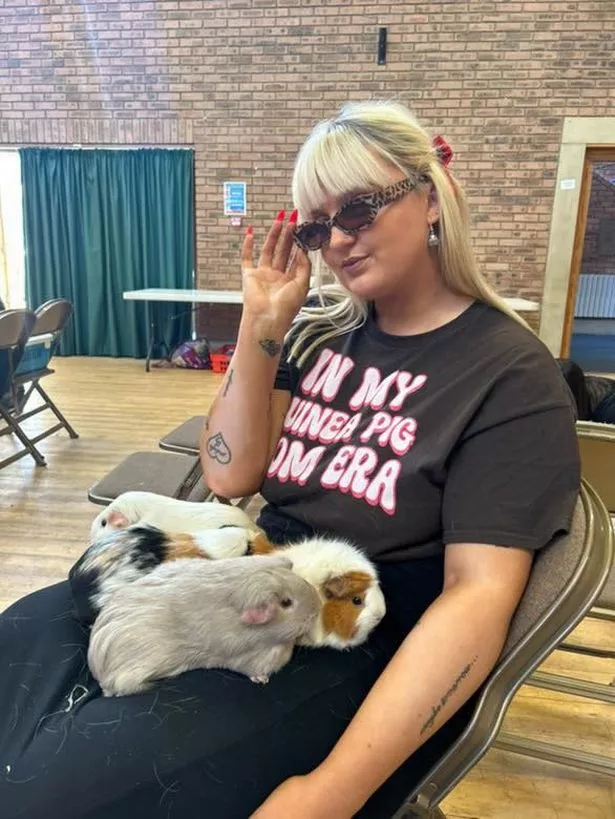Savannah with her guinea pigs Miley, Dolly, Vienna, and Angel