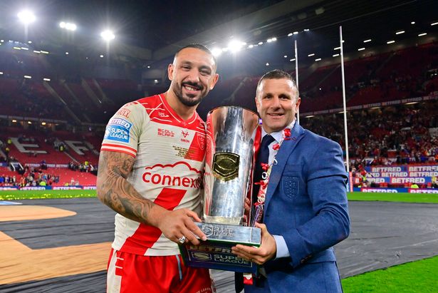 Hull KR captain Elliot Minchella and head coach Willie Peters with the Grand Final trophy at Old Trafford.