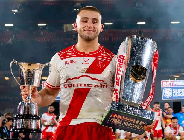 Hull KR's Mikey Lewis with the Rob Burrow Award and Betfred Super League trophy at Old Trafford.