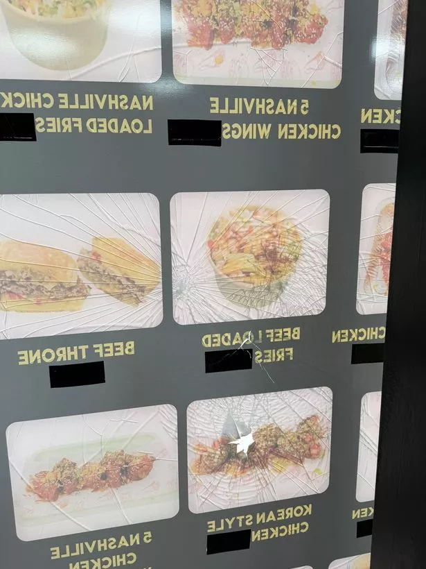 A smashed window at Korna Grill