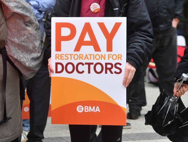 A 'Pay restoration' placard held by resident doctors outside a hospital in a previous round of industrial action this year