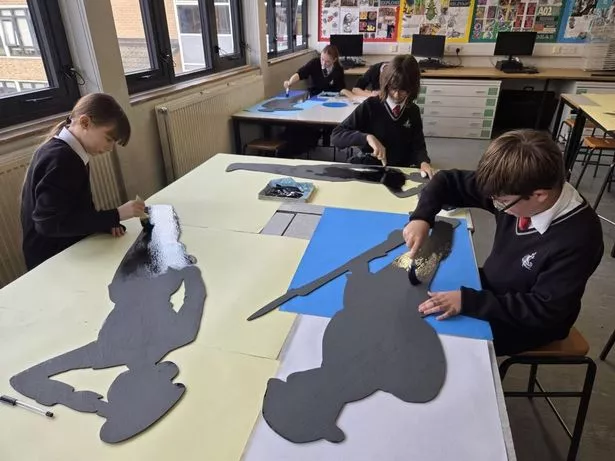 Cottingham High School pupils create the silhouettes.