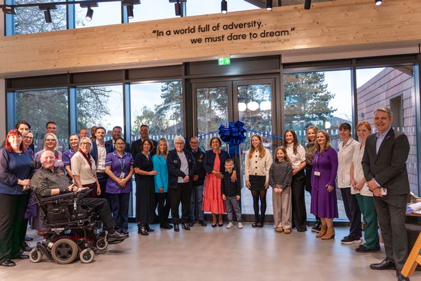 Clinical staff, patients and the Burrow family inside the new Rob Burrow Centre for MND