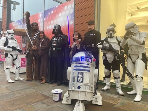 R2-D2 with fellow Star Wars legends at a sci-fi event