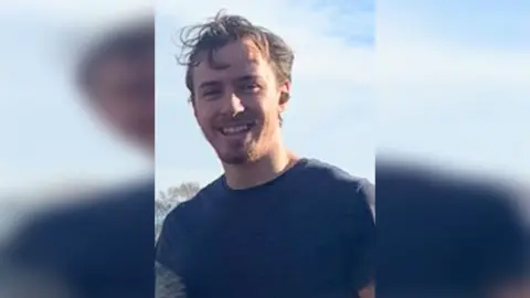 Humberside Police Picture of Sid Sefton he has brown hair and beard and is wearing a blue T-shirt