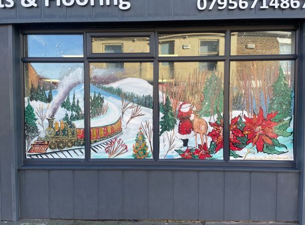 Sutton Carpets owner Jamie Cain commissioned Jenny Tribillon to paint the window.