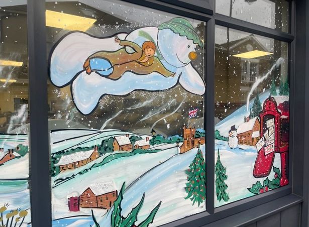 Jenny Tribillon specialises in painting Christmas windows.