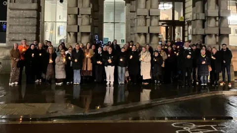 BBC/Lara King Crowd of people stood outside Grimsby Town Hall.