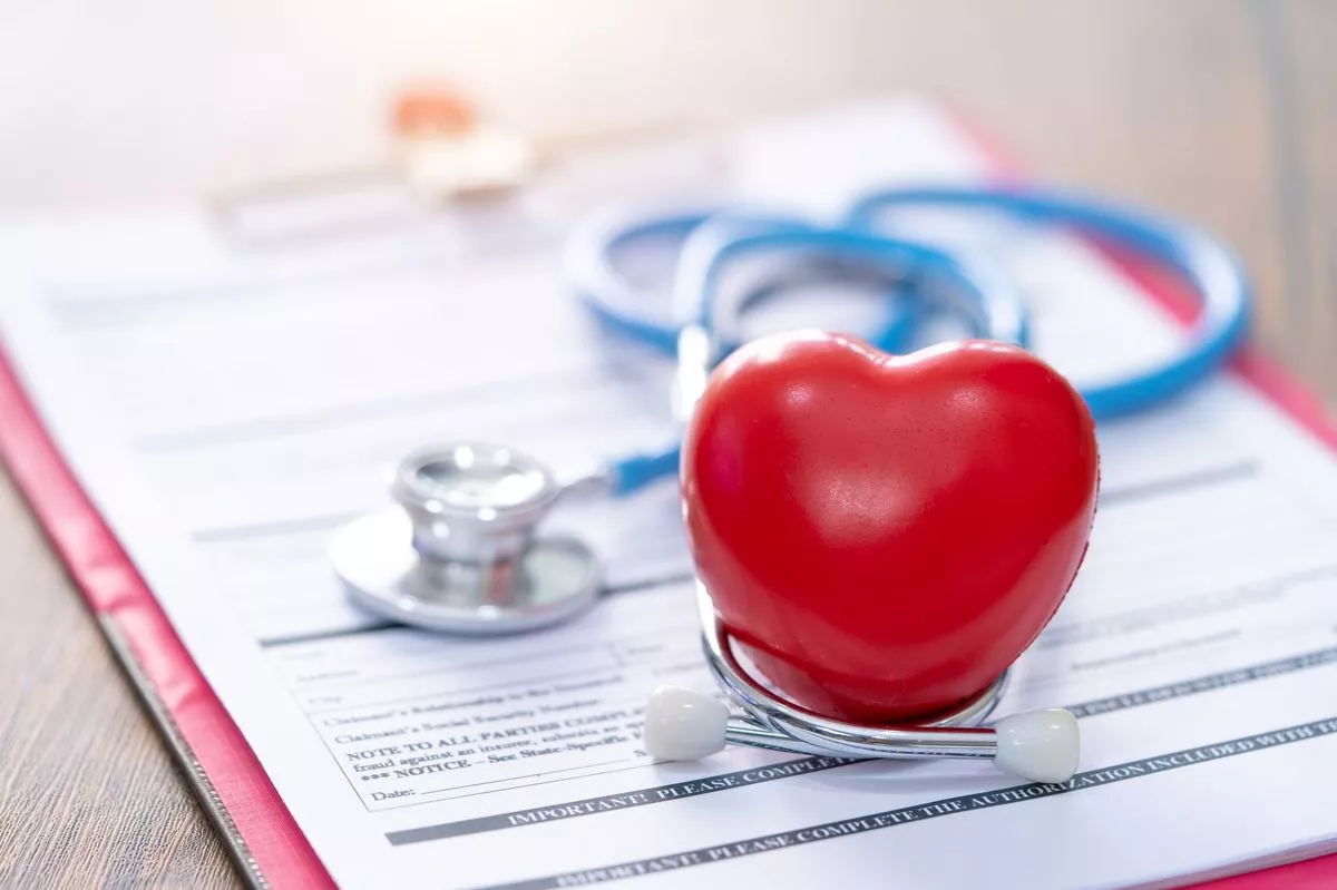 stethoscope and calculator on document