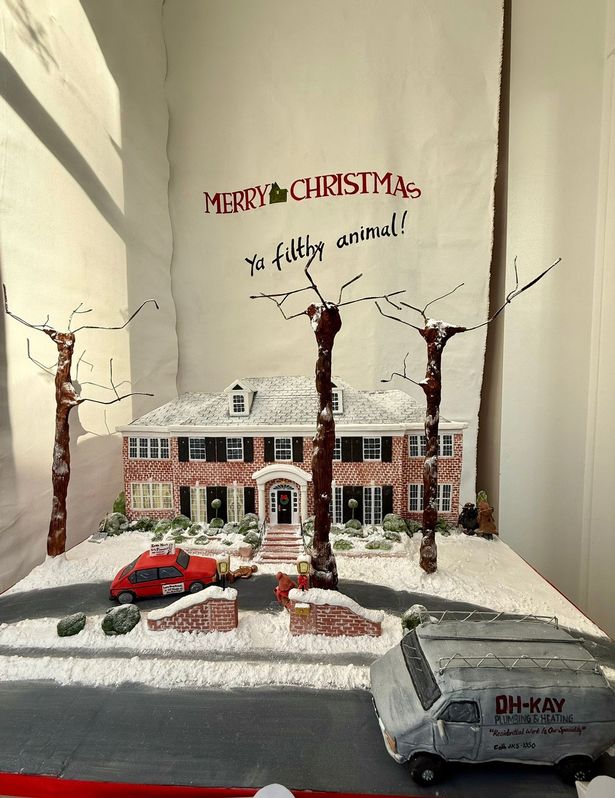 Grace Hunt's Home Alone house shop window display, with a backdrop painted by her artist mum Tracy Savage