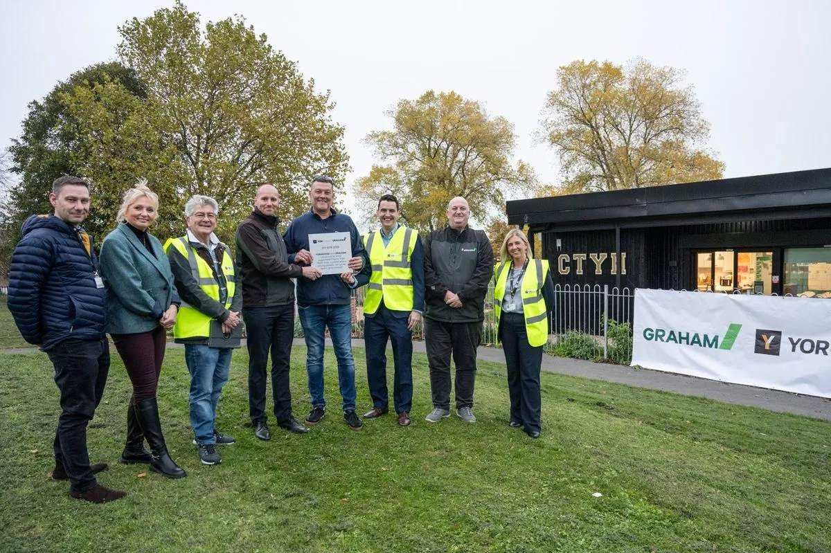 At the plaque presentation outside the Cherry Tree Youth Hub are: Andrew Humphrey (ERYC project manager), Jo Ramsay (Cherry Tree manager), Stan Brown (YOR4Good coordinator), Daniel Cawthra (GRAHAM head of stakeholder & community engagement), Tony Henderson (Cherry Tree treasurer), Phil Henderson (YOR4Good chair), James Stevenson (GRAHAM contracts manager) and Stefanie Wright (YOR4Good vice chair)