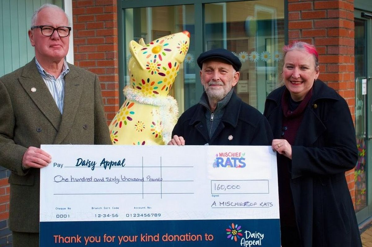 From left, Prof Nick Stafford, chair of the Daisy Appeal and co-directors of A Mischief of Rats, Rick Welton and Clare Huby, with the cheque for £160,000