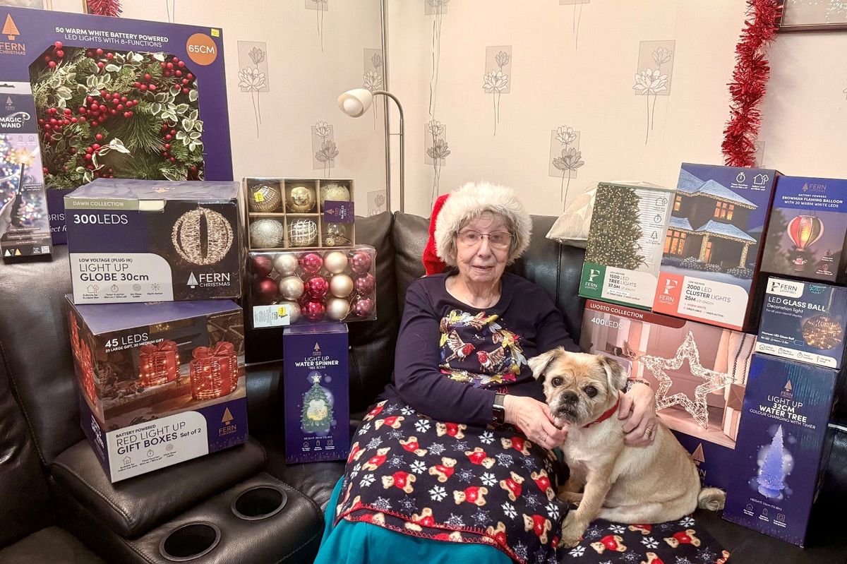 Sheila Turner with her 'Light Up Your House' prizes, including a collection of British Garden Centres’ own brand Fern Christmas decorations