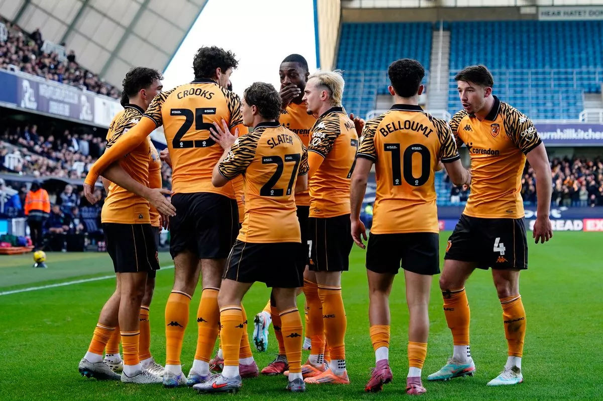 Hull City's Kyle Joseph celebrates with teammates at Millwall