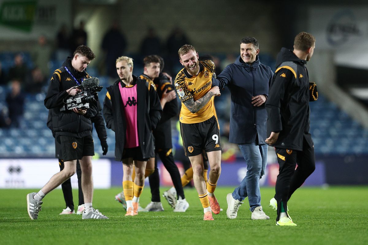 Oli McBurnie and Sergej Jakirovic share a joke at full-time