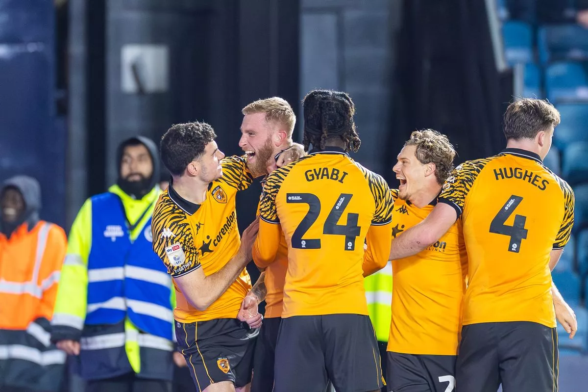 Hull City's players celebrate Oli McBurnie's goal at Millwall