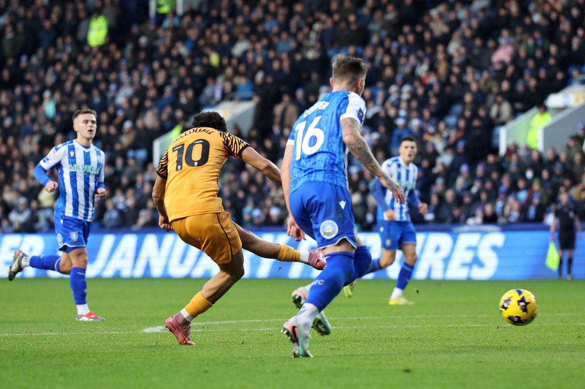 Mohamed Belloumi of Hull City scores against Sheffield Wednesday
