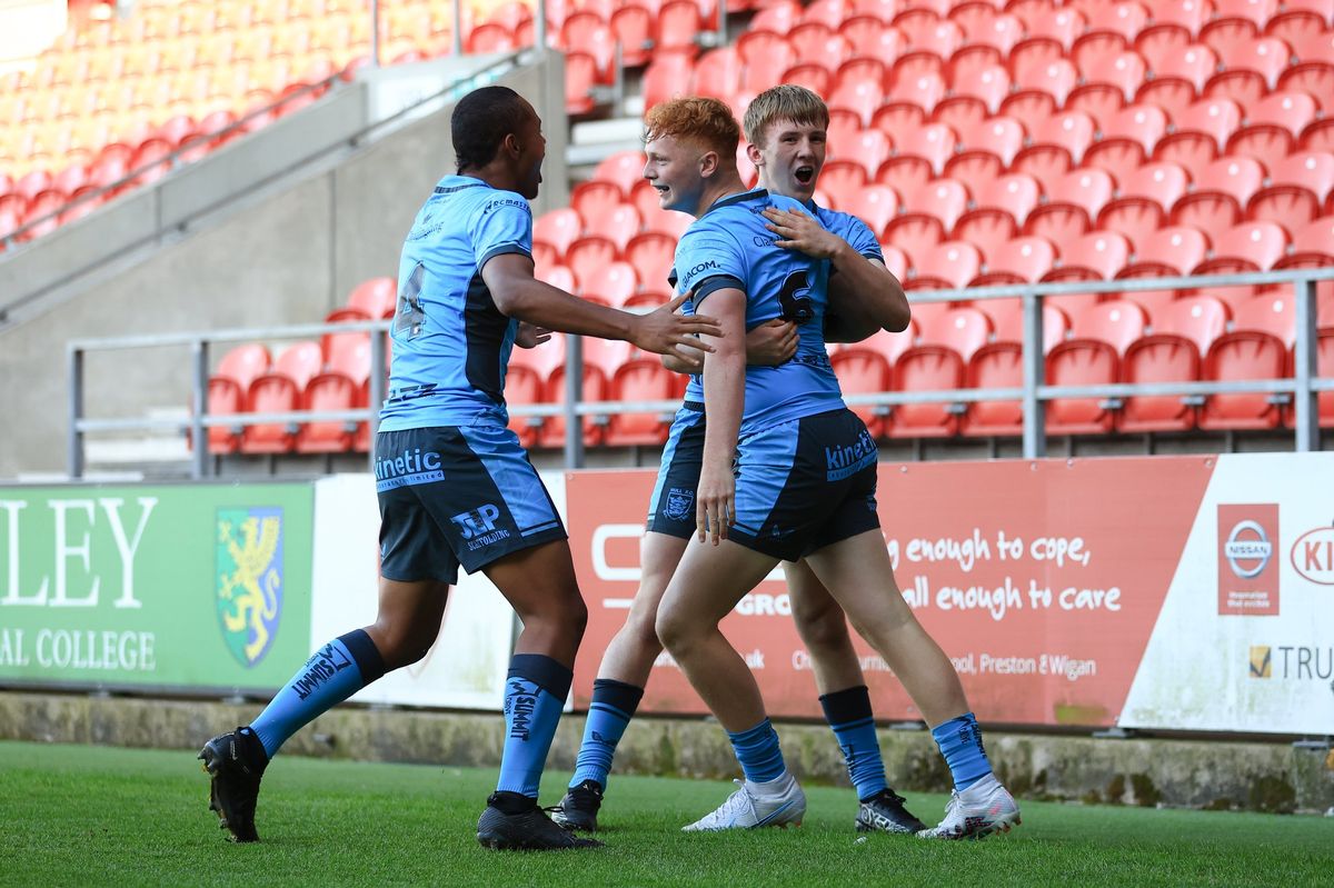 Hull FC scholarship celebrate Kingsley Sharpe's try at St Helens.