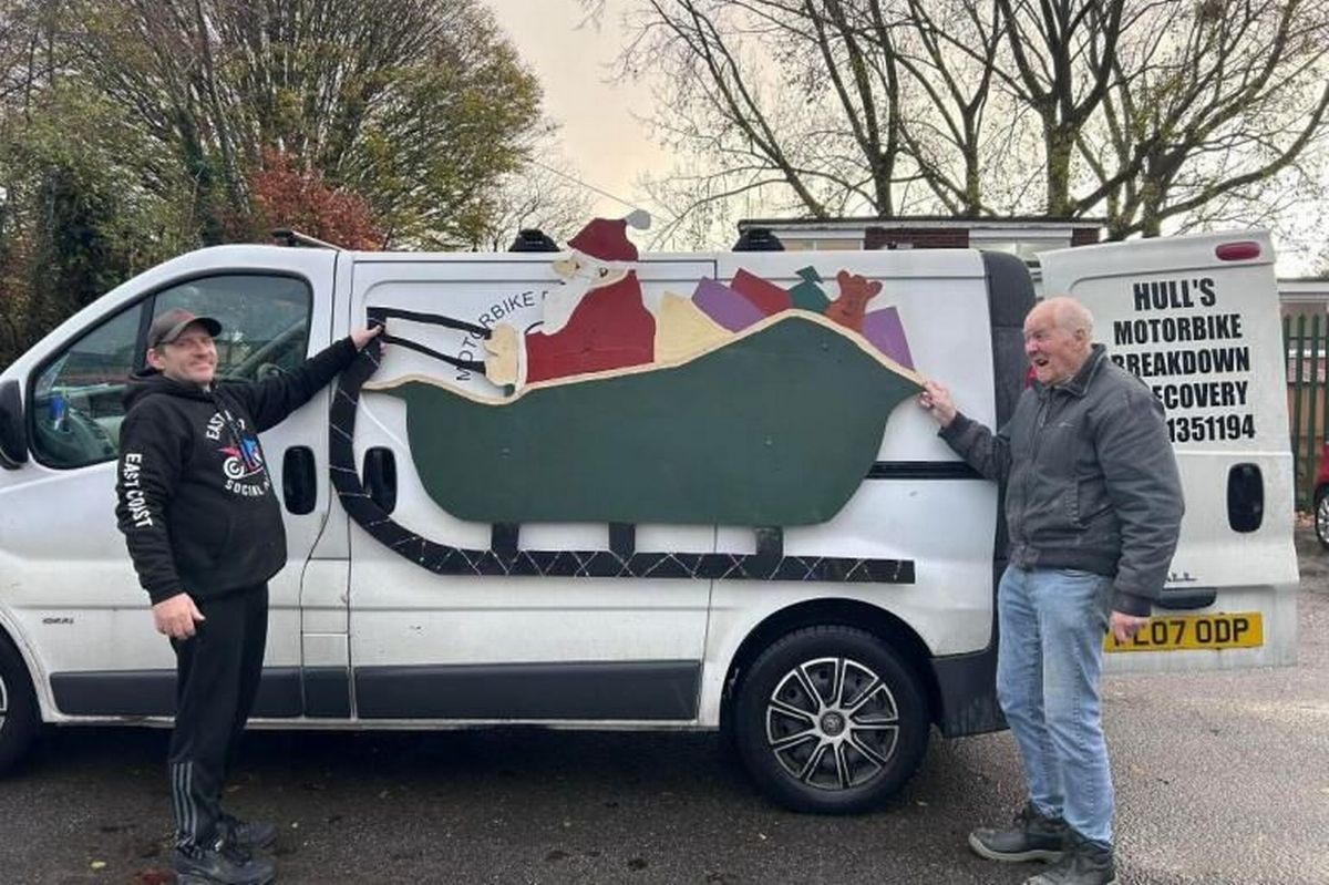 Mike Barley (left) with Tony from Men In Sheds who has made custom signs for the van