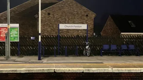 BBC/Seb Cheer A railway station platform with a sign reading "Church Fenton".