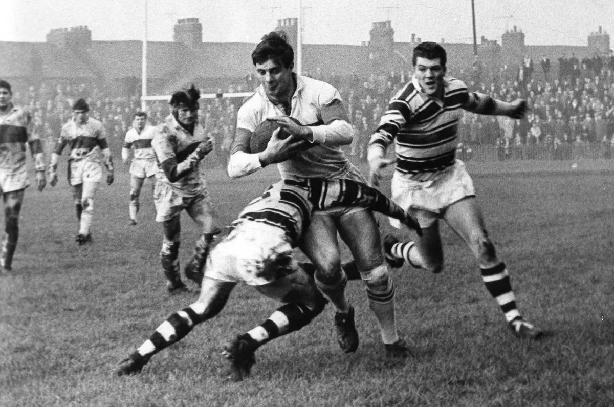David Doyle-Davidson tackles Blackmore during the Christmas Day derby at the Bouelvard in 1965